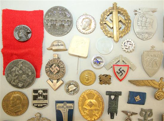 A large collection of various German Third Reich badges,